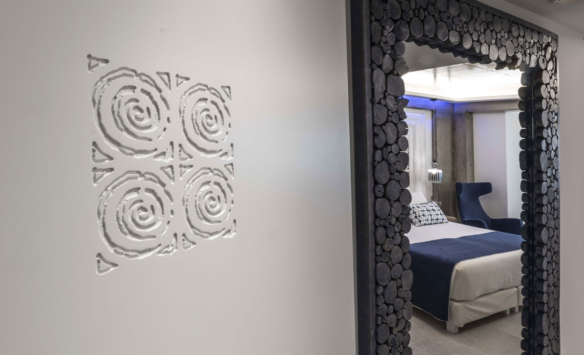 Cretan Blue Beach Hotel hotel room with large mirror and decorative details on the wall